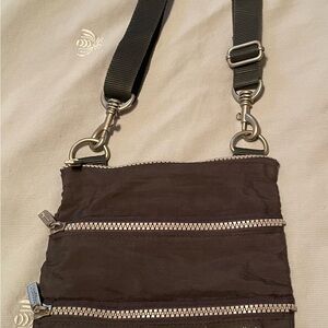 Baggallini dark gray Crossbody Bag with Multi-Zipper Design. 9” x 7”
